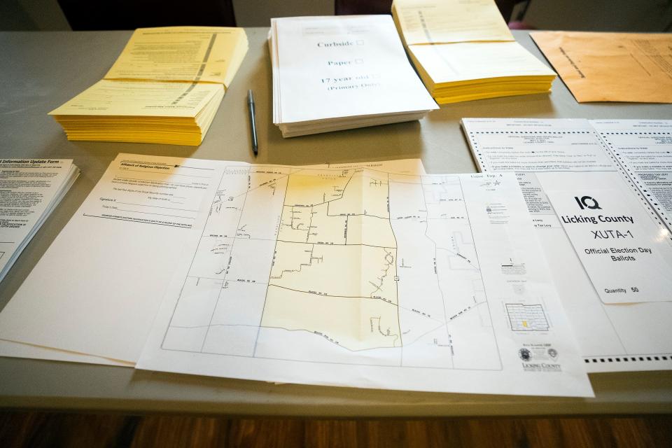 A guide to the eligible voting district sits on a table Tueday at the Union Township Hall in Hebron.