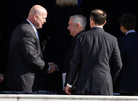 Acting U.S. Attorney General Matthew Whitaker shakes hands with U.S. Secretary of Defense James Mattis after ceremonies on Veteran's Day at Arlington National Cemetery in Arlington, Virginia, U.S., November 11, 2018. REUTERS/Joshua Roberts