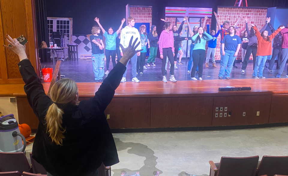 Fairhaven High School theatre mentor Marisa Rebelo, left, gives blocking instructions to students during a rehearsal of "The Prom."