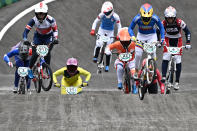 <p>Britain's Bethany Shriever (911) Colombia's Mariana Pajon (100) compete in the cycling BMX racing women's final at the Ariake Urban Sports Park during the Tokyo 2020 Olympic Games in Tokyo on July 30, 2021. (Photo by Jeff PACHOUD / AFP)</p> 