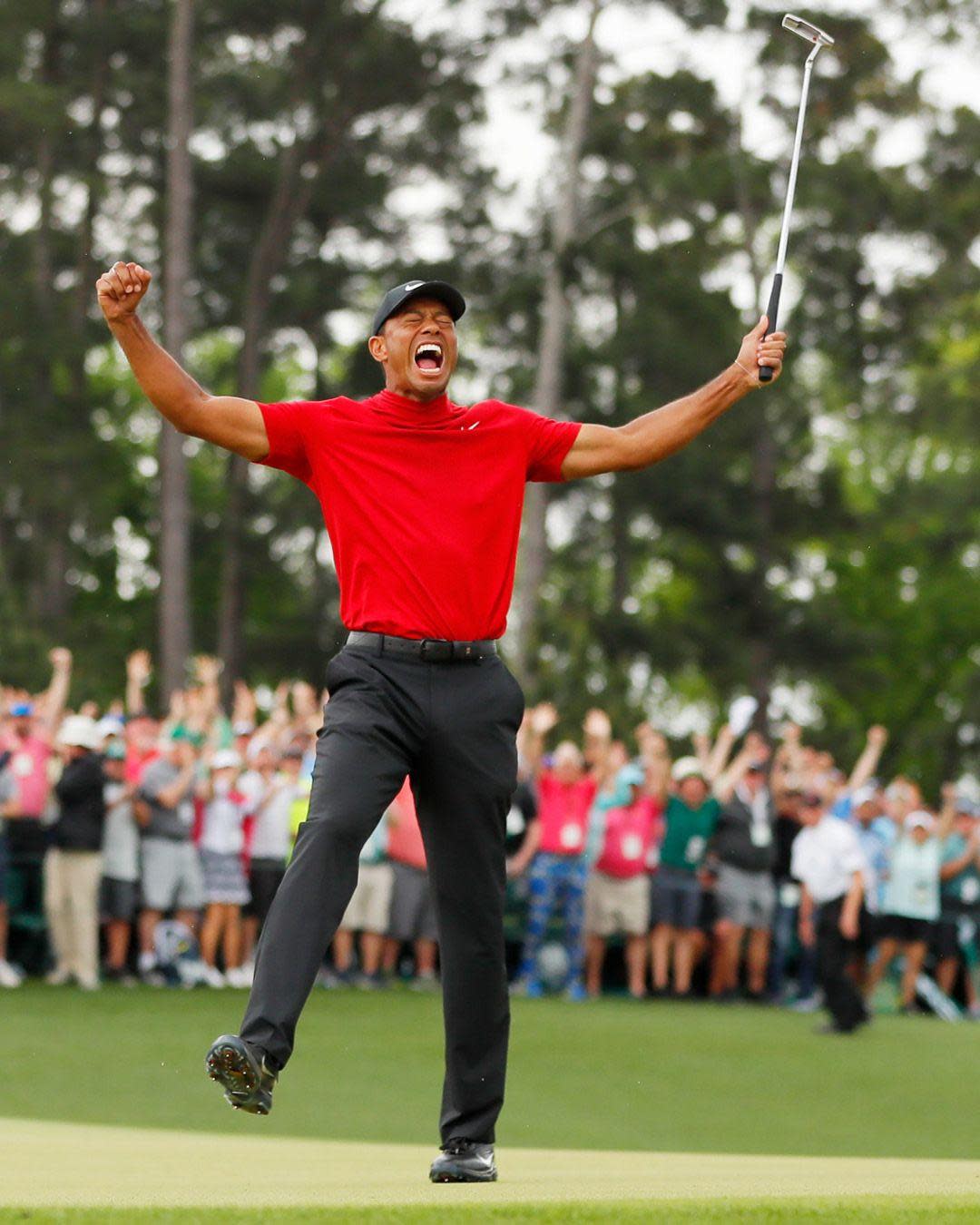 Tiger Woods celebrates