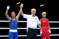 LONDON, ENGLAND - AUGUST 06: Chungneijang Mery Kom Hmangte (Blue) of India celebrates after defeating Maroua Rahali (Red) of Tunisia in the Women's Fly (51kg) Boxing Quarterfinals on Day 10 of the London 2012 Olympic Games at ExCeL on August 6, 2012 in London, England. (Photo by Scott Heavey/Getty Images)