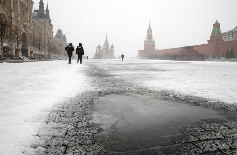 FILE PHOTO: Police officers patrol Red Square in Moscow