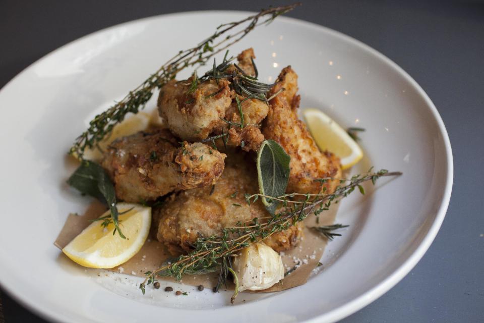 In this photo taken Monday, Oct. 29, 2012, chef Tyler Florence's fried chicken dish at his Wayfare Tavern in San Francisco. Baby food and fried chicken may well be the legacy for which Tyler Florence ultimately is best known. Which seems a bit crazy given his near ubiquity on the Food Network since its earliest days on air, his years of running the celebrity chef gauntlet, his many cookbooks, product lines and appearances. (AP Photo/Eric Risberg)