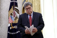 Attorney General William Barr participates in a law enforcement briefing on the MS-13 gang with President Donald Trump in the Oval Office of the White House, Wednesday, July 15, 2020, in Washington. (AP Photo/Patrick Semansky)