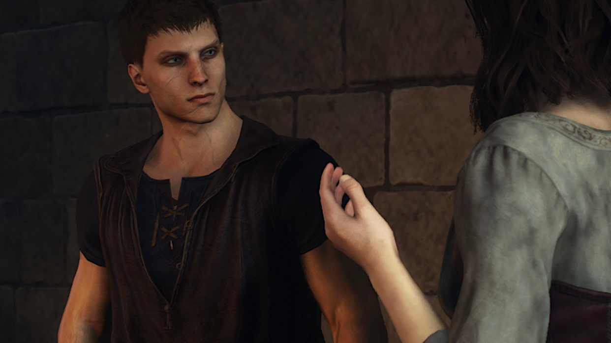  A quizzical-looking Arisen with short red hair and a numerous amount of scars looks gently confused as something is explained to him in Dragon's Dogma 2. 