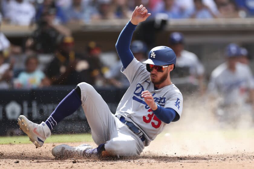 Los Angeles Dodgers' Cody Bellinger scores on a single hit by Trea Turner.