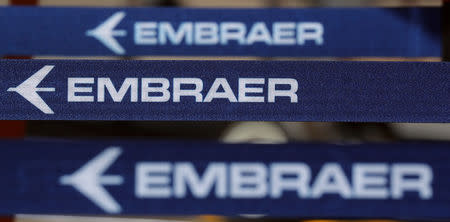 FILE PHOTO: The logo of Brazilian aviation company Embraer is seen during the Latin American Business Aviation Conference & Exhibition fair (LABACE) at Congonhas Airport in Sao Paulo, Brazil August 14, 2018. REUTERS/Paulo Whitaker/File Photo