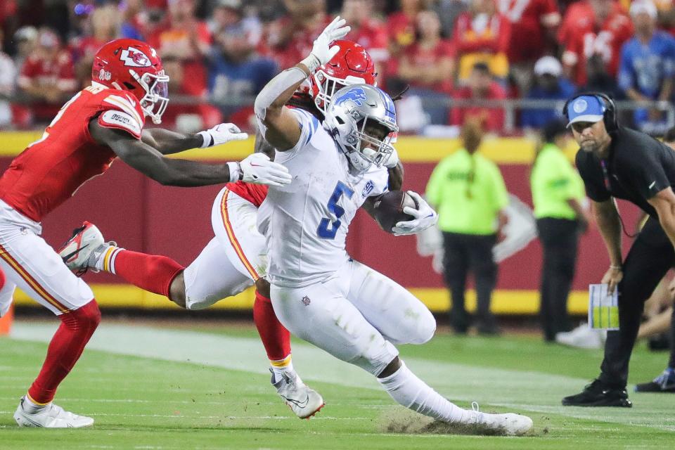 Lions running back David Montgomery runs against Chiefs defensive end Mike Danna during the second half of the Lions' 21-20 win on Thursday, Sept. 7, 2023, in Kansas City, Missouri.