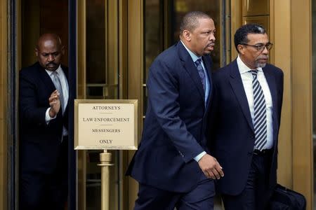 FILE PHOTO: Lamont Evans (C), former associate head basketball coach for Oklahoma State University, exits the Manhattan Federal Courthouse, following an appearance for bribery and fraud charges in connection with college basketball recruiting, in New York, U.S., October 12, 2017. REUTERS/Brendan McDermid