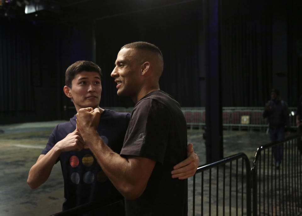 In this Wednesday March 27, 2019, photo, UFC fighter Edson Barboza, right, poses with a fan after a workout in Philadelphia. Barboza fights Justin Gaethje in a lightweight bout in the main event of the UFC card in Philadelphia on March 30. The bout features two of the most ferocious kickers in the sport, who are both coming off wins following two straight losses. Gaethje viewed the fight as an elimination bout of sorts for each fighter to stay in the hunt for a championship match against Khabib Nurmagomedov. (AP Photo/Jacqueline Larma)