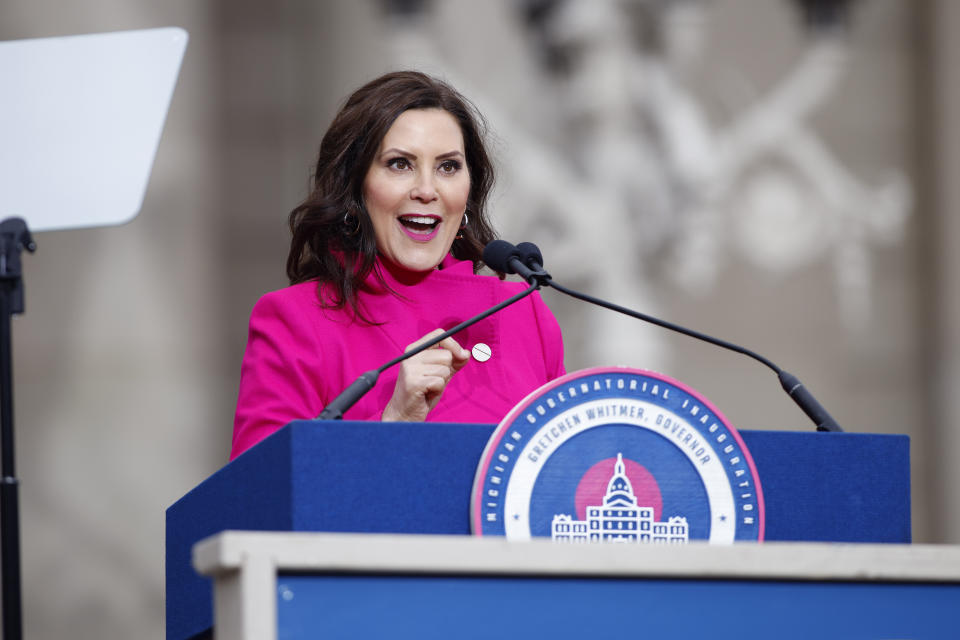 Michigan Gov. Gretchen Whitmer addresses the crowd during her inauguration, Sunday, Jan. 1, 2023, outside the state Capitol in Lansing, Mich. (AP Photo/Al Goldis)