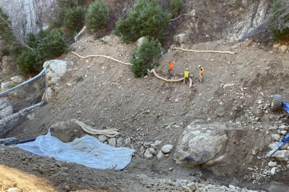 Workers repair the sides of the stream in San Ysidro Creek after cleaning out the nearby debris net. Jessica Peak/Storrer Environmental Services photo