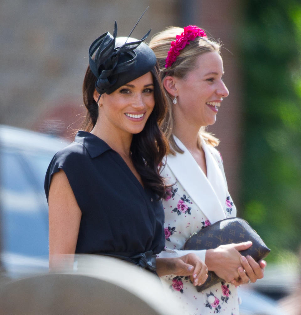 Laughing with a fellow guest.&nbsp; (Photo: Antony Jones via Getty Images)