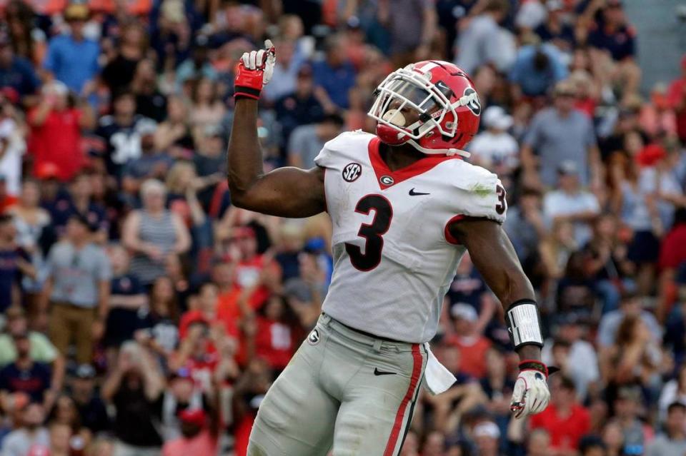 Georgia running back Zamir White (3) celebrates after a touchdown against Auburn during the second half of an NCAA college football game Saturday, Oct. 9, 2021, in Auburn, Ala. (AP Photo/Butch Dill)