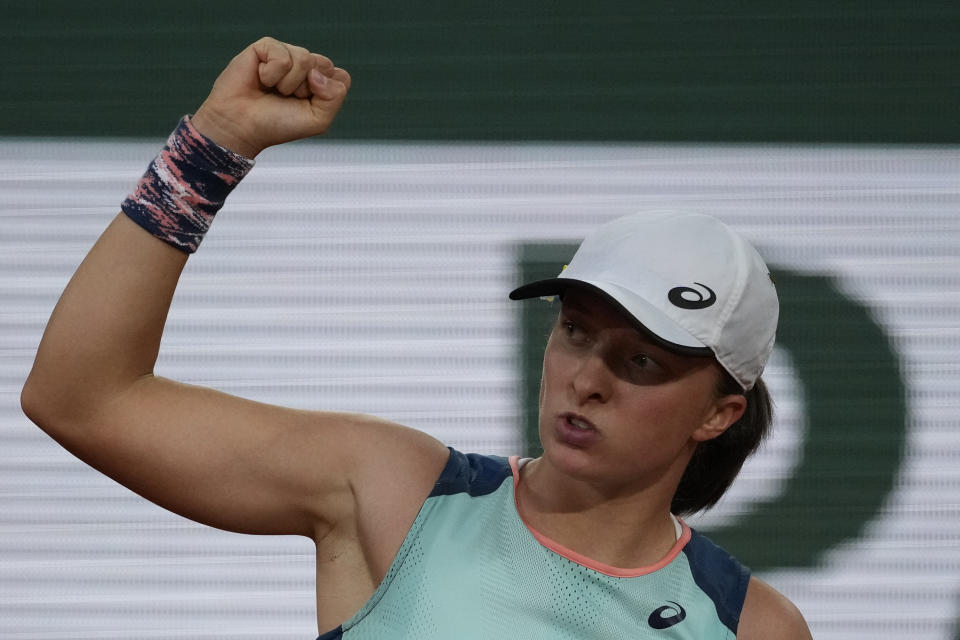 Poland's Iga Swiatek reacts after scoring a point as she plays Coco Gauff of the U.S. during the women final match of the French Open tennis tournament at the Roland Garros stadium Saturday, June 4, 2022 in Paris. (AP Photo/Christophe Ena)