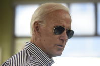 Democratic presidential candidate former Vice President Joe Biden pays for his order at a Krispy Kreme following a campaign town hall on Wednesday, Aug. 28, 2019, in Spartanburg, S.C. (AP Photo/Meg Kinnard)