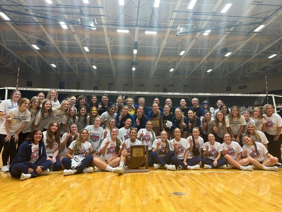 Castle and Tecumseh volleyball with their semistate trophies.