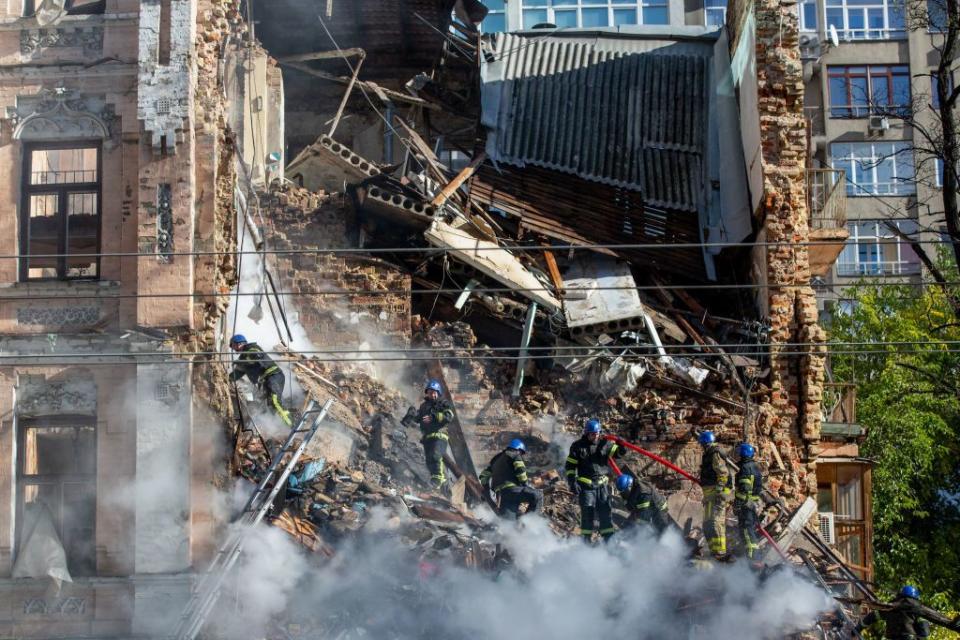 First responders work at the site of a residential building destroyed by a Russian Shahed-136 drone strike in Kyiv, Ukraine on Oct. 17, 2022. (Oleksii Chumachenko/SOPA Images/LightRocket via Getty Images)