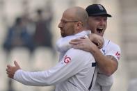 England's Jack Leach, left, celebrates with teammate after taking the wicket of Pakistan Muhammad Rizwan during the second day of the second test cricket match between Pakistan and England, in Multan, Pakistan, Saturday, Dec. 10, 2022. (AP Photo/Anjum Naveed)