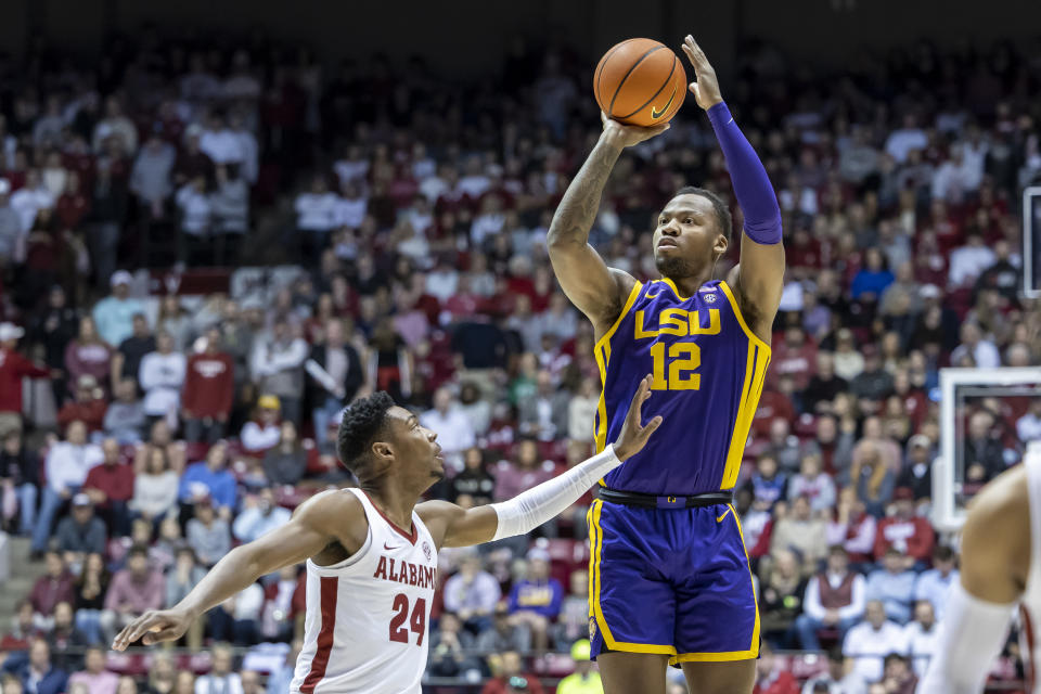 LSU forward KJ Williams (12) shoots over Alabama forward Brandon Miller (24) during the first half of an NCAA college basketball game, Saturday, Jan. 14, 2023, in Tuscaloosa, Ala. (AP Photo/Vasha Hunt)