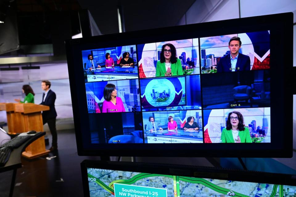 Studio monitors show images of Denver mayoral candidates Kelly Brough and Mike Johnston, as well as moderators and reporters, during a Denver mayoral runoff debate in the studios of Channel 7 News on May 23, 2023. <a href="https://www.gettyimages.com/detail/news-photo/monitors-in-the-studio-show-images-of-denver-mayoral-news-photo/1492759787?adppopup=true" rel="nofollow noopener" target="_blank" data-ylk="slk:Helen H. Richardson/MediaNews Group/The Denver Post via Getty Images;elm:context_link;itc:0;sec:content-canvas" class="link ">Helen H. Richardson/MediaNews Group/The Denver Post via Getty Images</a>