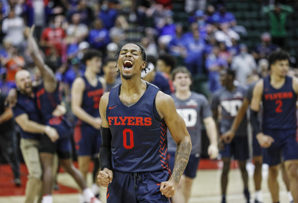 Dayton guard Elijah Weaver celebrates their win over Kansas in an NCAA college basketball game Friday, Nov. 26, 2021, in Lake Buena Vista, Fla. (AP Photo/Jacob M. Langston)