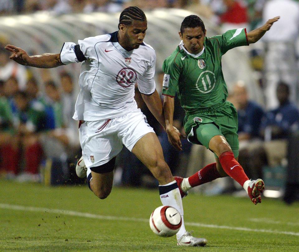 COLUMBUS, OH - SEPTEMBER 3:  Oguchi Onyewu #22 of the USA vies for the ball with Ramon Morales #11 of Mexico during their 2006 World Cup Qualifying match at Crew Stadium on Septermber 3, 2005 in Columbus, Ohio. The USA won 2-0.  (Photo by Victor Decolongon/Getty Images)