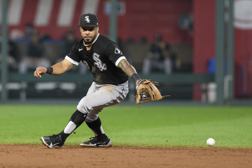 Chicago White Sox shortstop Leury Garcia tries to track down a ball hit by Kansas City Royals' Andrew Benintendi for a single during the fifth inning of a baseball game, Friday, Sept. 3, 2021, in Kansas City, Mo. (AP Photo/Reed Hoffmann)