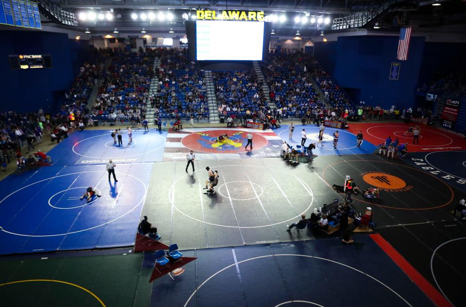 11 mats are in use (with three more in an adjacent space) during the first day of competition in the Beast of the East tournament at the Bob Carpenter Center in Newark, Saturday, Dec. 17, 2022.