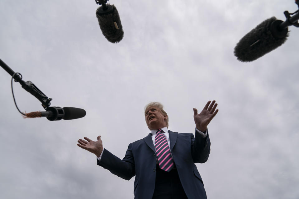 President Donald Trump talks to reporters before boarding Air Force One for a trip to Phoenix to visit a Honeywell plant that manufactures protective equipment, Tuesday, May 5, 2020, in Andrews Air Force Base, Md. (AP Photo/Evan Vucci)