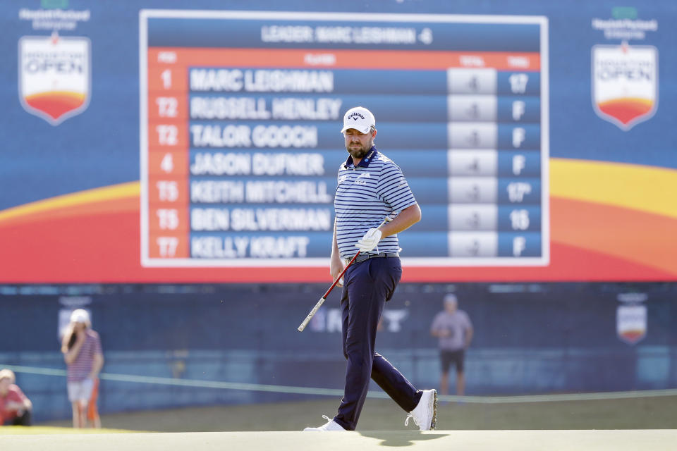 Marc Leishman looks at the 18th green during the first round of the Houston Open golf tournament Thursday, Nov. 11, 2021, in Houston. (AP Photo/Michael Wyke)