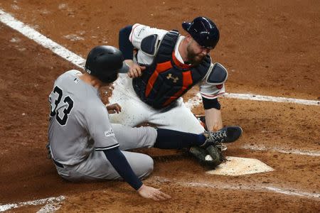 Oct 21, 2017; Houston, TX, USA; New York Yankees first baseman Greg Bird (33) is out at home as Houston Astros catcher Brian McCann (16) applies the tag during the fifth inning in game seven of the 2017 ALCS playoff baseball series at Minute Maid Park. Troy Taormina-USA TODAY Sports