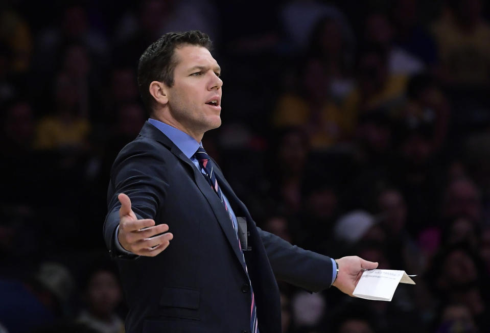 Los Angeles Lakers coach Luke Walton gestures during the second half of the team's NBA basketball game against the Portland Trail Blazers on Tuesday, April 9, 2019, in Los Angeles. The Trail Blazers won 104-101. (AP Photo/Mark J. Terrill)