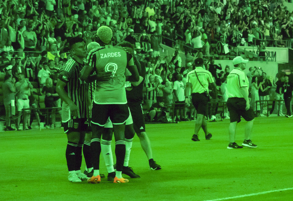 Austin FC teammates congratulate Gyasi Zardes on his winning header goal after defeating Toronto in an MLS soccer game, Saturday, May 20, 2023, in Austin, Texas. (AP Photo/Michael Thomas)