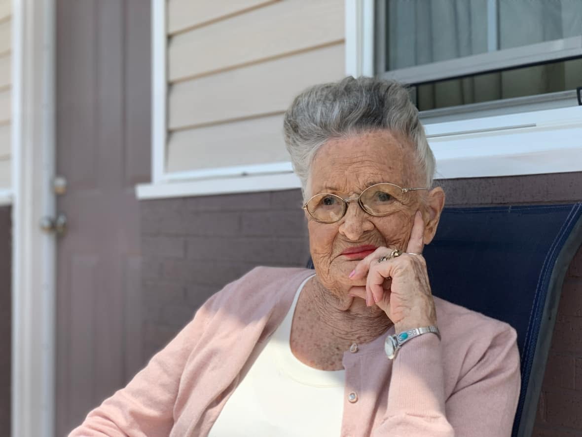 Hazel Stedman sits outside her apartment at Coady's Place, a new co-op housing project in New Glasgow. (Michael Gorman/CBC - image credit)