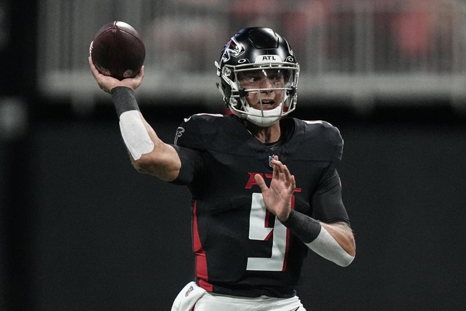 Atlanta Falcons quarterback Desmond Ridder (9) works against the Cincinnati Bengals during the first half of an NFL preseason football game, Friday, Aug. 18, 2023, in Atlanta. (AP Photo/Brynn Anderson)