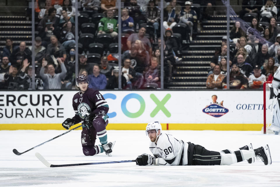 Los Angeles Kings center Pierre-Luc Dubois (80) reacts after a check by Anaheim Ducks right wing Troy Terry (19) during the second period of an NHL hockey game Tuesday, April 9, 2024, in Anaheim, Calif. (AP Photo/William Liang)