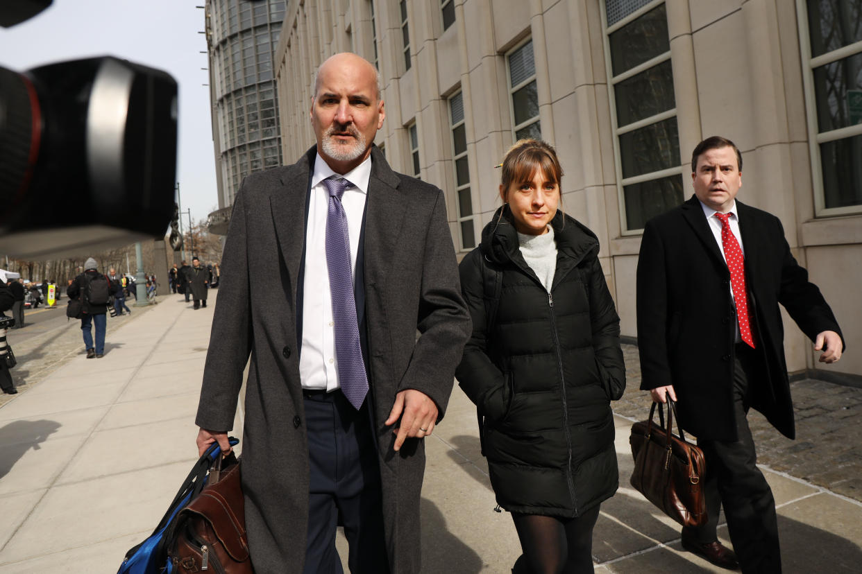 Allison Mack leaves the Brooklyn Federal Courthouse with her lawyers after a court appearance on Feb. 6, 2019. (Photo: Getty Images)