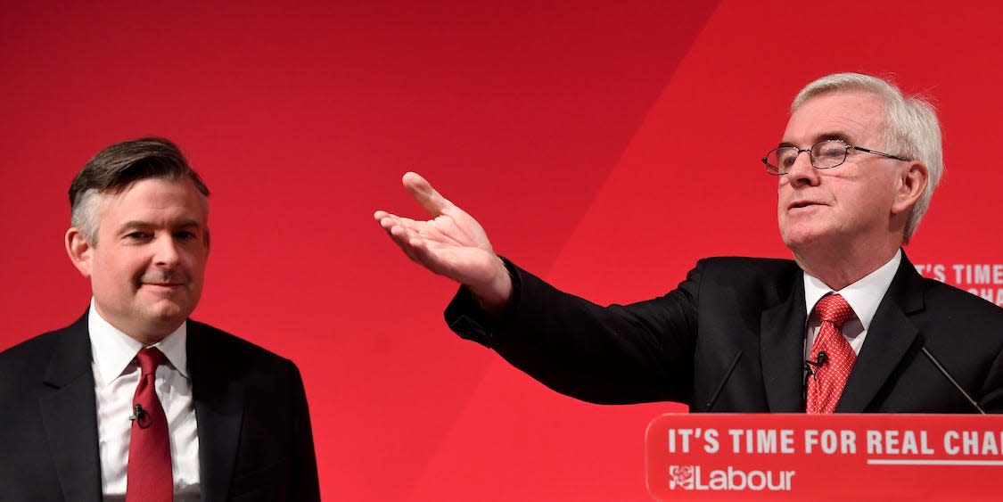 Shadow Chancellor John McDonnell gestures next to Jonathan Ashworth, the Shadow Secretary of State for Health and Social Care, at an election campaign event in London, Britain November 13, 2019. REUTER/Toby Melville