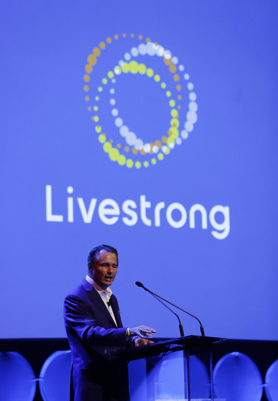 In this Monday, Feb. 3, 2020 photo, Livestrong president and CEO Greg Lee speaks at an event where the new Livestrong logo was unveiled in Austin, Texas. The Livestrong cancer charity is on a mission to reinvent itself. It has survived a dramatic fall in contributions and donations since founder Lance Armstrong's performance-enhancing drug scandal. (AP Photo/Eric Gay)