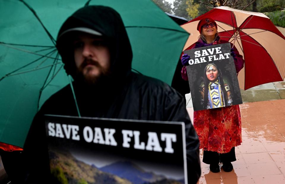 Protesters stand outside the 9th Circuit Court of Appeals in Pasadena