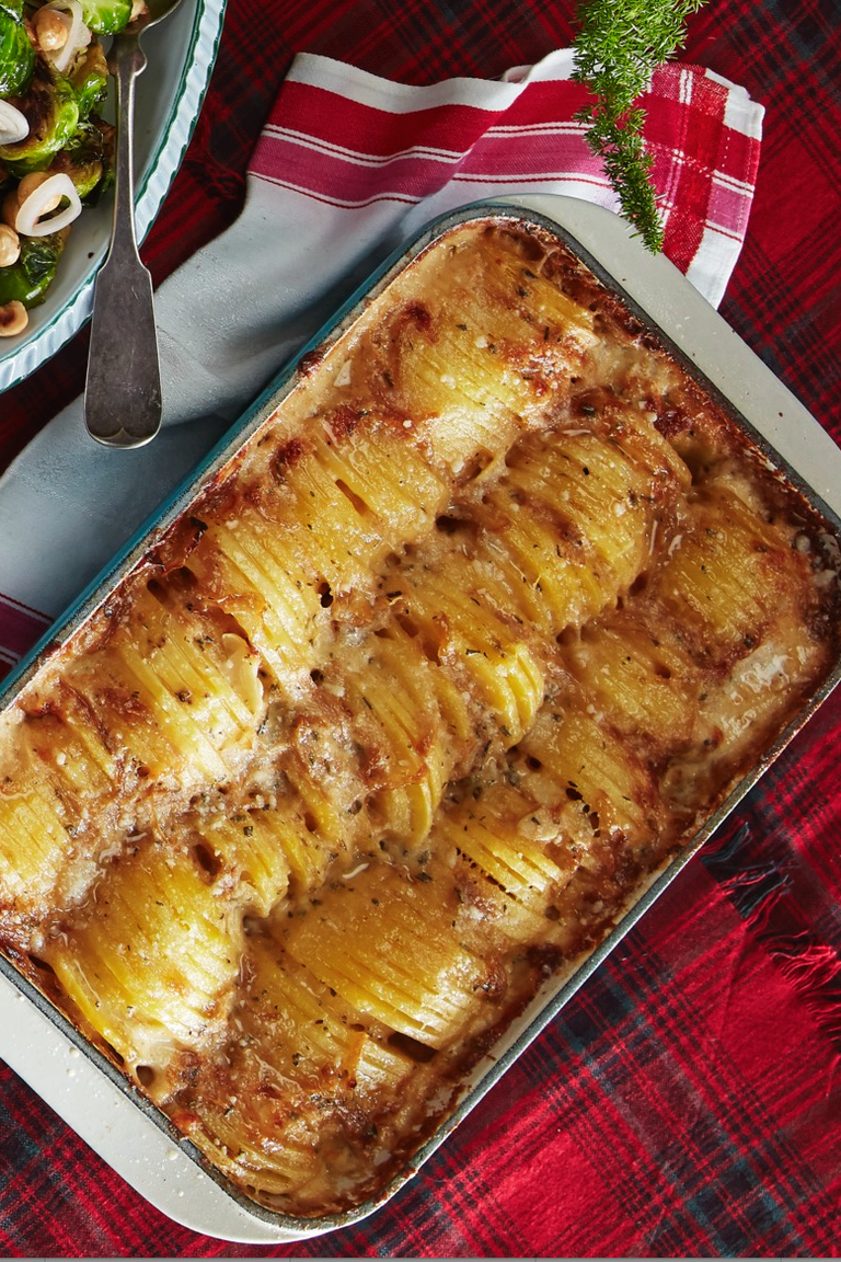 <p>No Christmas table is complete without two things: cheese and loads of potatoes. Luckily, this dish has both.</p><p><strong><a href="https://www.countryliving.com/food-drinks/a29626417/hasselback-potato-gratin-recipe/" rel="nofollow noopener" target="_blank" data-ylk="slk:Get the recipe;elm:context_link;itc:0;sec:content-canvas" class="link ">Get the recipe</a>.</strong> </p>