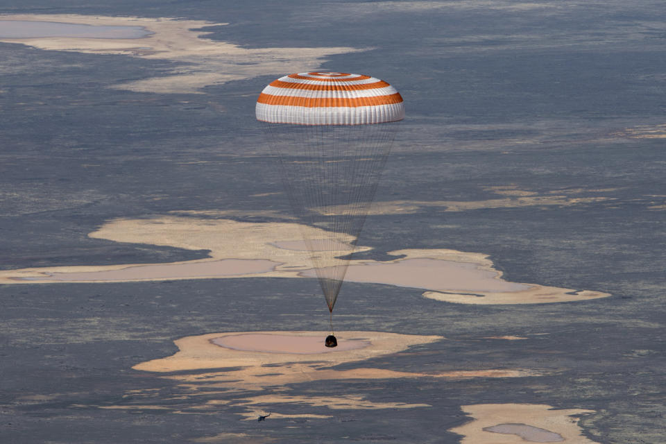 In this handout photo released by Gagarin Cosmonaut Training Centre (GCTC), Roscosmos space agency, the Soyuz MS-15 space capsule carrying International Space Station (ISS) crew members descends beneath a parachute just before landing in a remote area near Kazakh town of Dzhezkazgan, Kazakhstan, Friday, April 17, 2020. An International Space Station crew has landed safely after more than 200 days in space. The Soyuz capsule carrying NASA astronauts Andrew Morgan, Jessica Meir and Russian space agency Roscosmos' Oleg Skripochka touched down on Friday on the steppes of Kazakhstan. (Andrey Shelepin, Gagarin Cosmonaut Training Centre (GCTC), Roscosmos space agency, via AP)