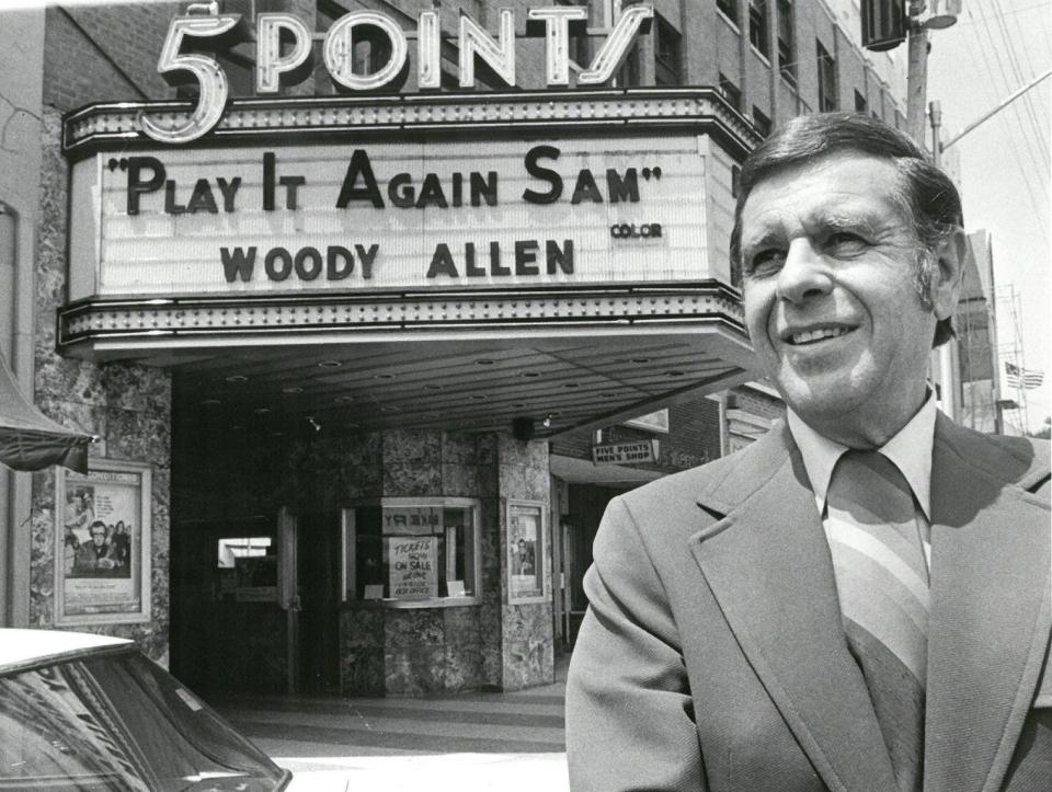 Sept. 1 1972: The proprietor of the 5 Points Theatre poses in front of the theater’s marquee.
