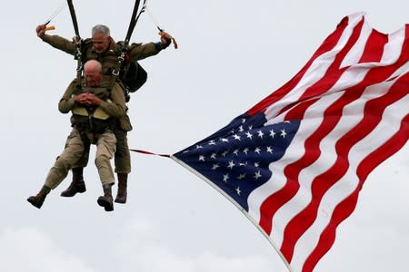 U.S. World War II paratrooper veteran Tom Rice, 97 years-old who served with the 101st Airbone, jumps during a commemorative parachute jump over Carentan on the Normandy coast