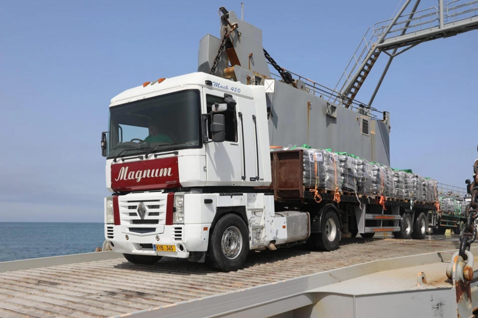 A truck loaded with humanitarian aid from the United Kingdom moves onto the Trident Pier from the U.S. Army’s LSV-6 to head toward the beach in Gaza, May 17, 2024. ( Sgt. Mikayla Fritz/U.S. Army Central via AP)