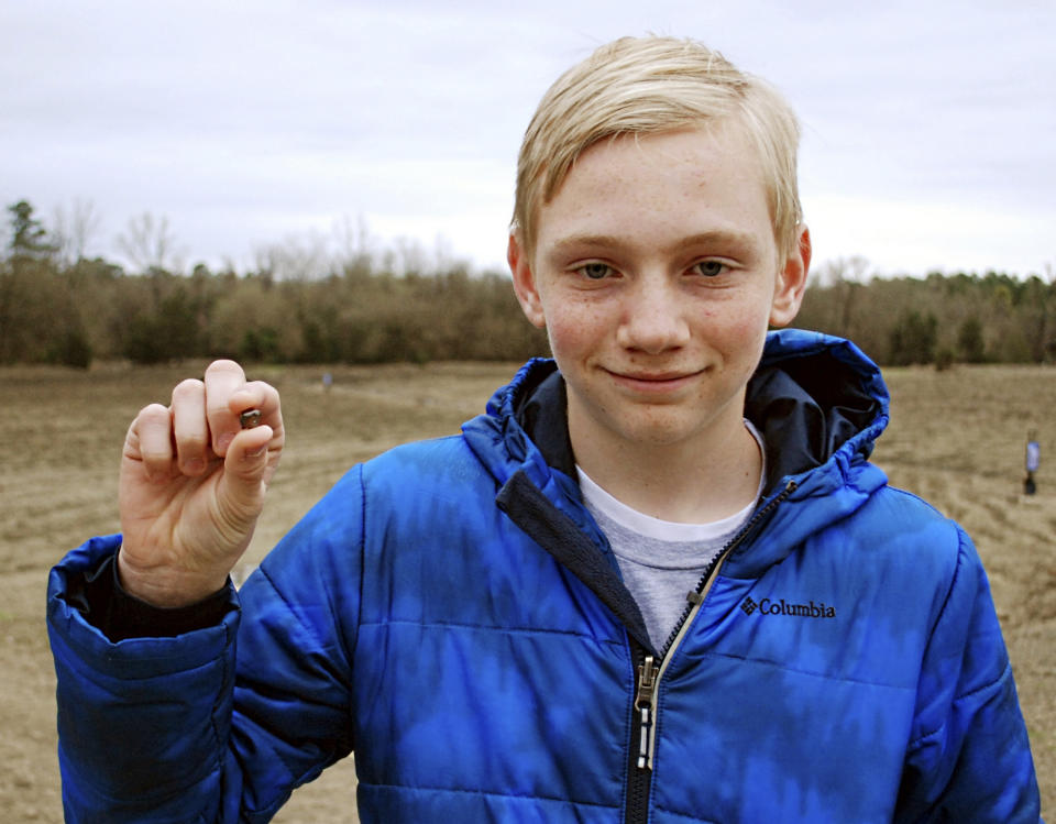 This Saturday, March 11, 2017, photo, provided by the Arkansas Department of Parks & Tourism shows Kalel Langford holding a 7.44 carat diamond he found at Crater of Diamonds State Park in Murfreesboro, Ark. Officials at the park said the diamond is the seventh largest found since the park was established in 1972. (Waymon Cox/Arkansas Department of Parks & Tourism via AP)