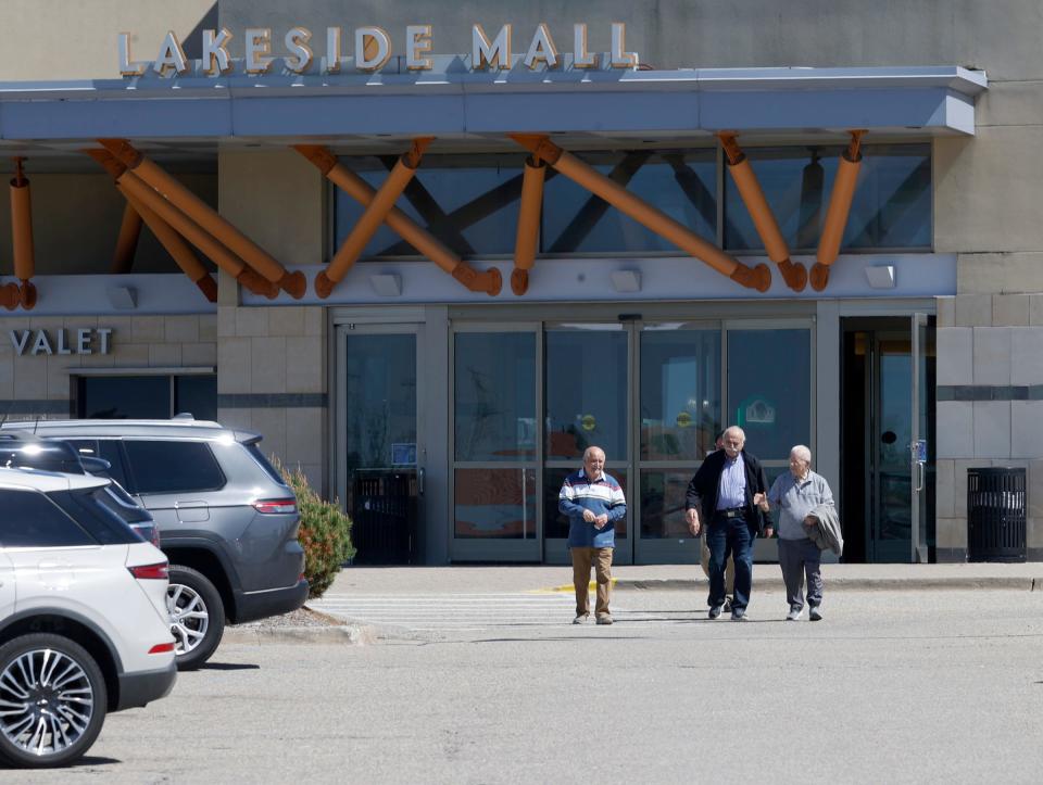 People walk in and out of Lakeside Mall in Sterling Heights on Tuesday, April 30, 2024. The tenants inside are being told they have to move out by July 1, 2024, as the longtime mall is closing. The site will be redeveloped as a mixed-use project.