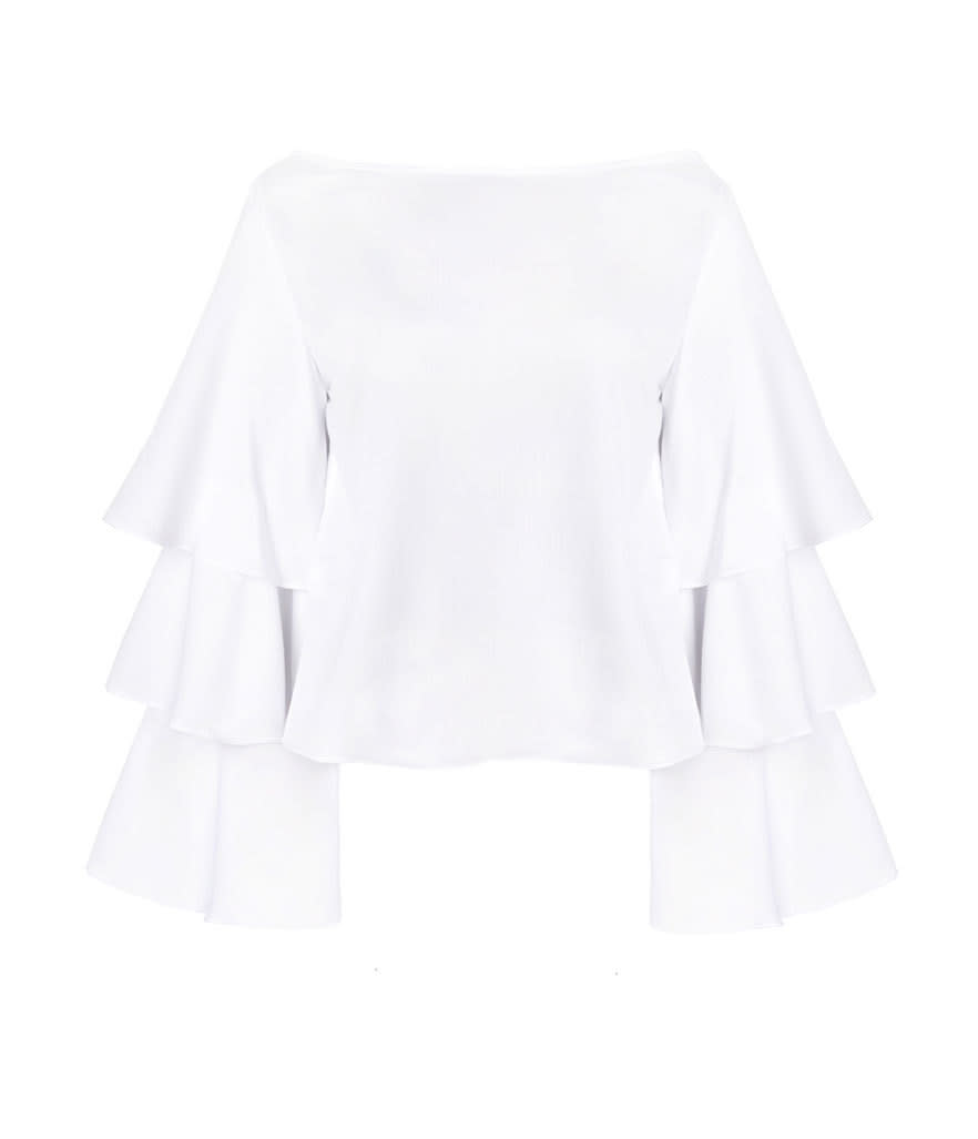 <p>White Ruffed Tier Top, $84, <a href="http://www.pixiemarket.com/white-ruffed-tier-top.html" rel="nofollow noopener" target="_blank" data-ylk="slk:pixiemarket.com;elm:context_link;itc:0;sec:content-canvas" class="link ">pixiemarket.com</a></p>